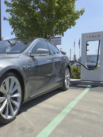 Hybrid car at charging station