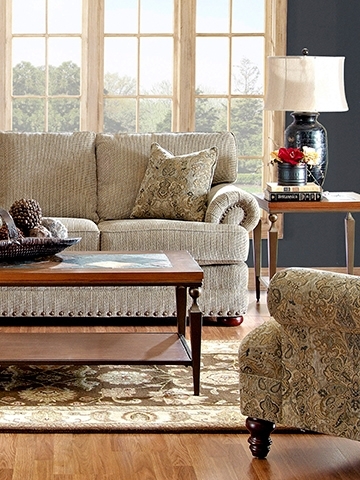Living room with beige and neutral colors, coffee table, area rug and big window
