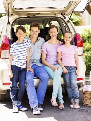 smiling family in trunk