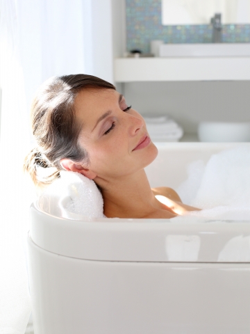 Close up of woman resting in bathtub