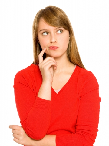 Woman in red sweater thinking and looking sideways