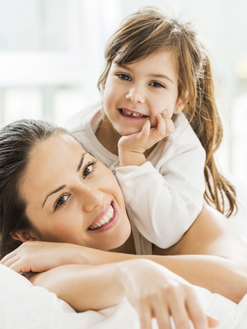 Mother and Daughter in bed